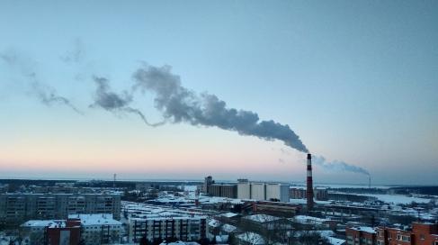 City skyline with steam emitting from building