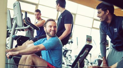 Several people working out in the gym.