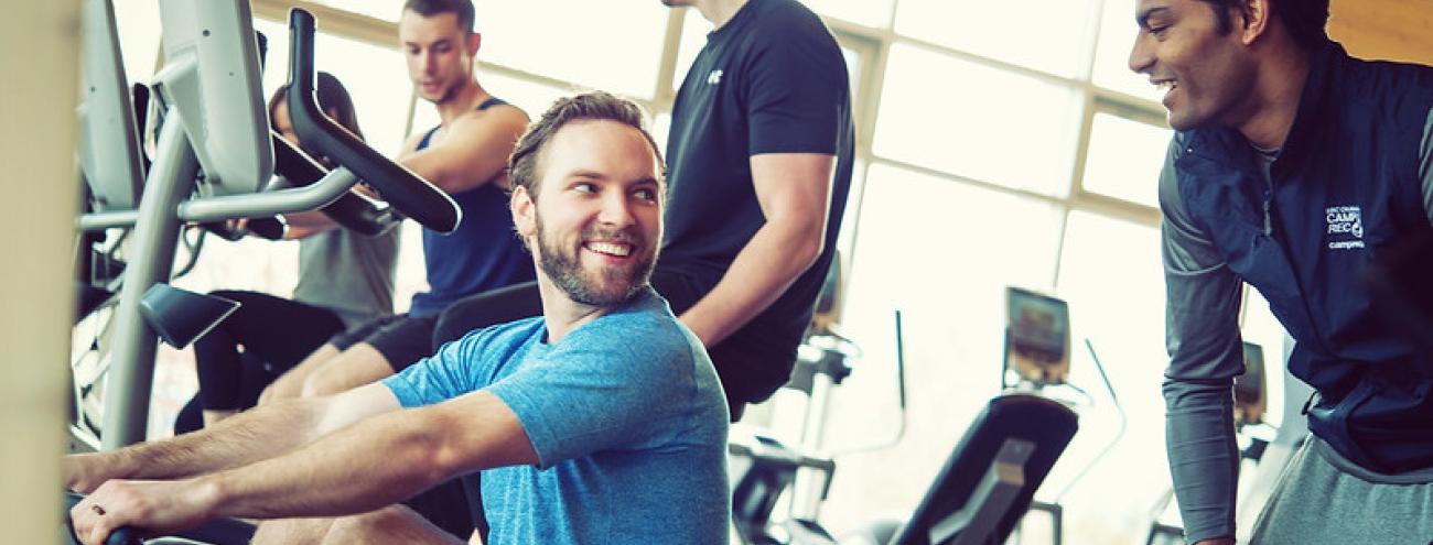 Several people working out in the gym.