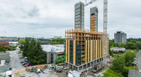 Two concrete cores and ground floor slab provide stability to the mass timber structure above.